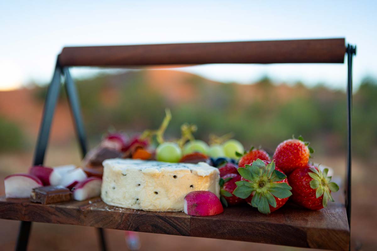 Cheese, strawberries and other snacks on tray